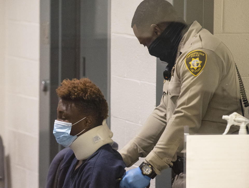 Former Raiders wide receiver Henry Ruggs, accused of DUI resulting in death, is brought into the courtroom during his initial arraignment at the Regional Justice Center, on Wednesday, Nov. 3, 2021, in Las Vegas. Ruggs was involved in the fiery crash early Tuesday that left one person dead. (Bizuayehu Tesfaye/Las Vegas Review-Journal via AP)