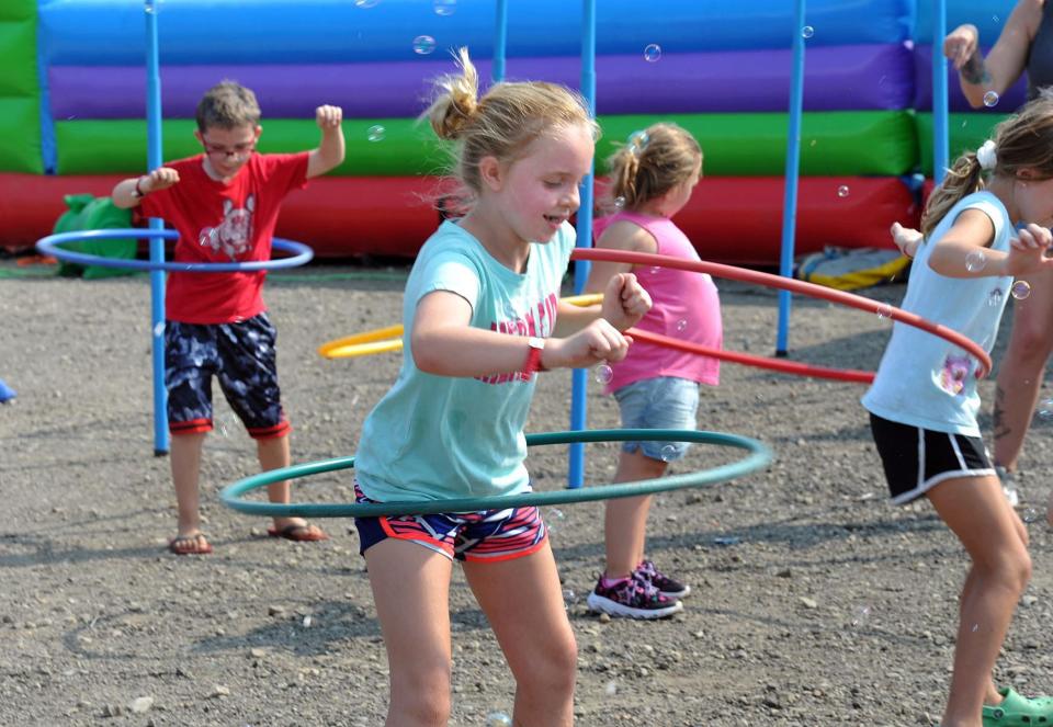 Fiona Reardon, 9, of Duxbury, competes in the hula hoop contest during the Marshfield LobsterFest, Sunday, Sept. 12, 2021.