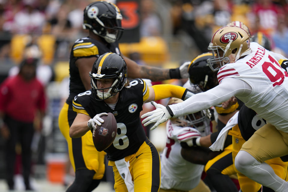 Pittsburgh Steelers quarterback Kenny Pickett (8) is pressured by San Francisco 49ers defensive end Arik Armstead (91) during the first half of an NFL football game Sunday, Sept. 10, 2023, in Pittsburgh. (AP Photo/Gene J. Puskar)