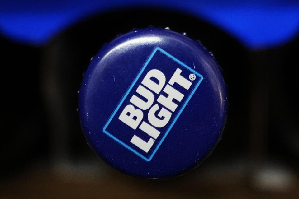 A bottle of Bud Light beer is seen at a grocery store in Glenview, Ill., Tuesday, April 25, 2023. Bud Light may have fumbled its attempt to broaden its customer base by partnering with a transgender influencer. But experts say inclusive marketing is simply good business __ and it’s here to stay. (AP Photo/Nam Y. Huh)