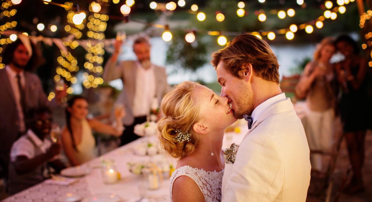 A bride and groom gave their wedding guests a bizarre 'kissing menu' with instructions on how to get the couple to lock lips [Image: Getty]