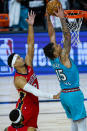 Memphis Grizzlies' Brandon Clarke (15) gets a dunk in front of New Orleans Pelicans' Josh Hart (3) during the first half of an NBA basketball game Monday, Aug. 3, 2020 in Lake Buena Vista, Fla. (AP Photo/Ashley Landis, Pool)