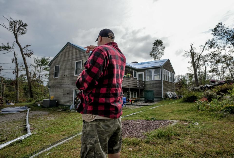 Richard O'Neill at his home in Scituate, where on Aug. 18 a tornado blew out the windows, ripped off the roof and turned his family's lives upside down.