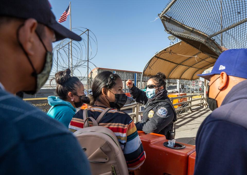 Migrants wanting to seek asylum in the U.S. are directed to inquire with Mexican authorities by a Customs and Border Protection officer on the Paso Del Norte bridge in El Paso, Texas on December 6, 2021. 