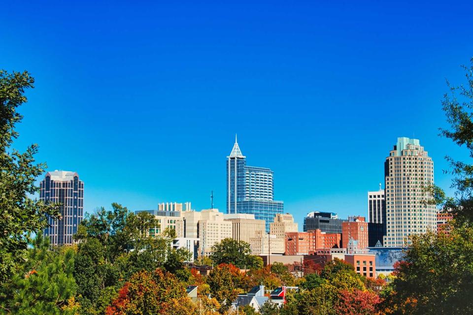 A beautiful cityscape in fall of the capital city Raleigh, North Carolina under a clear blue sky.