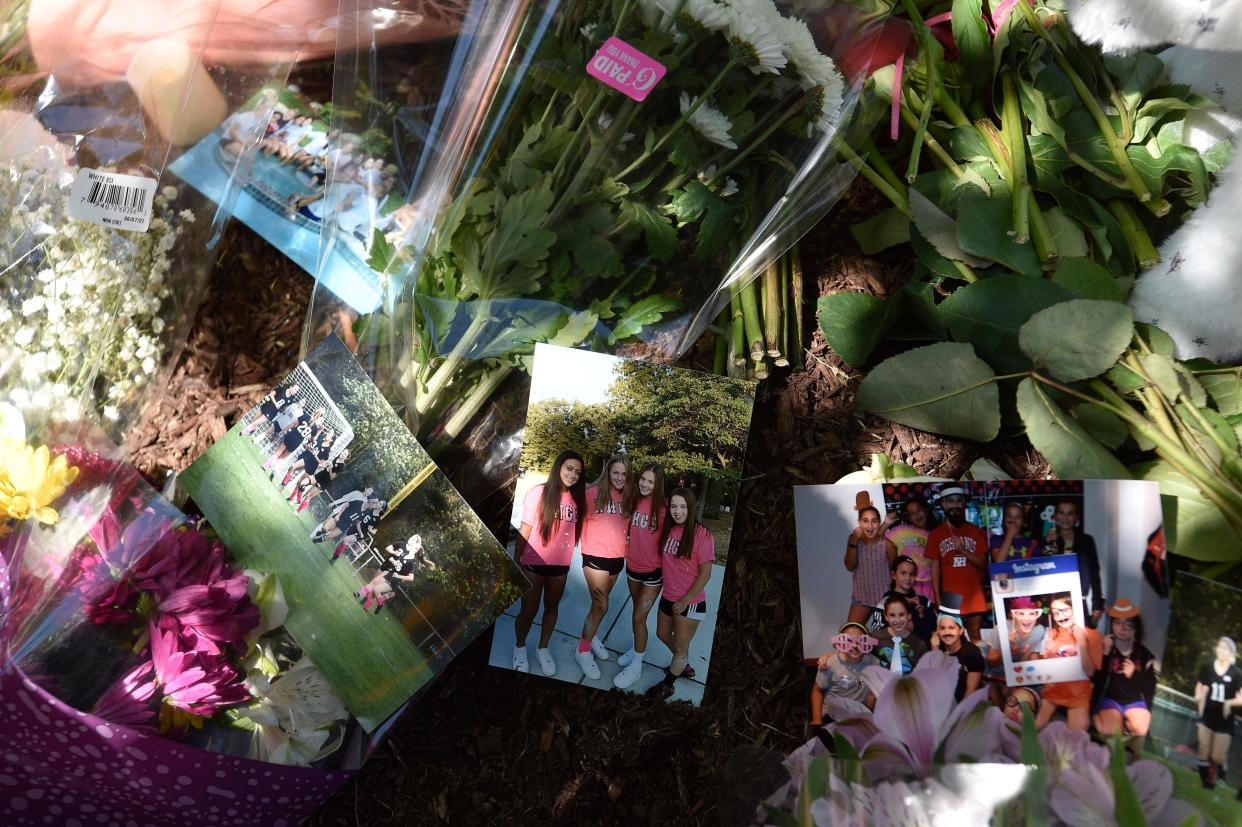 Flowers, photos and stuffed animals are placed on the front lawn of a home where Riley Boyle, 17, died in a fire at her home on Bonnie Way in Allendale. The fire occurred on June 4, 2022 in the late afternoon.