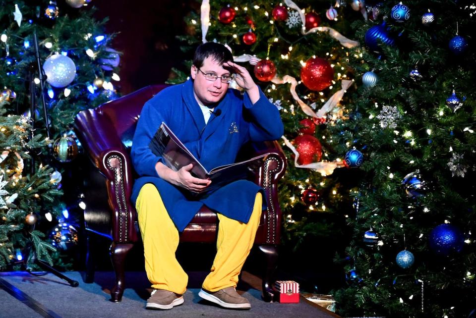 Justin Lambrecht, education director at the National Railroad Museum, does a dramatic reading of "The Polar Express" as Hero Boy for a sold-out audience.