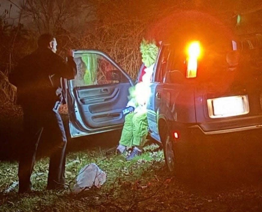 A man dressed as the Grinch was distracted and accidently drove his car through an Exeter, New Hampshire business' mailbox and road sign on Christmas night.