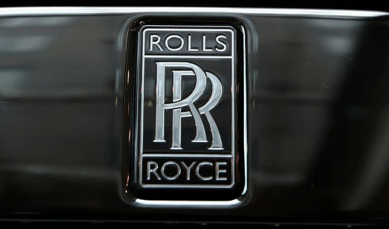 FILE PHOTO: The badge of a Rolls-Royce Black Badge Dawn car is seen at a dealership in London