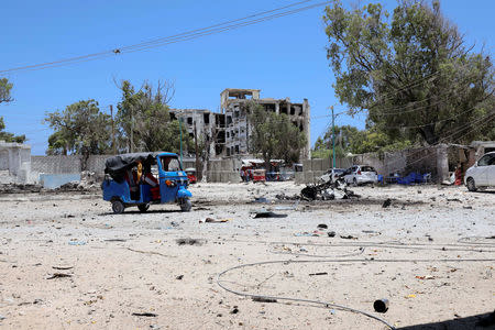 A general view shows the wreckage of a suicide car explosion after al-Shabaab militia stormed a government building in Mogadishu, Somalia March 23, 2019. REUTERS/Feisal Omar