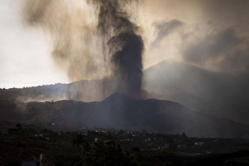 Lava from a volcano eruption flows on the island of La Palma in the Canaries, Spain, Wednesday, Sept. 22, 2021. A volcano on a small Spanish island in the Atlantic Ocean erupted on Sunday, forcing the evacuation of thousands of people. Experts say the volcanic eruption and its aftermath on a Spanish island could last for up to 84 days. The Canary Island Volcanology Institute said Wednesday it based its calculation on the length of previous eruptions on the archipelago. (AP Photo/Emilio Morenatti)