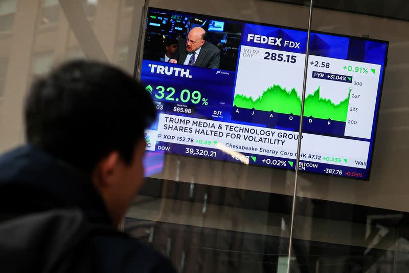 Shares of Truth Social and Trump Media & Technology Group shares displayed outside Nasdaq Market site in New York