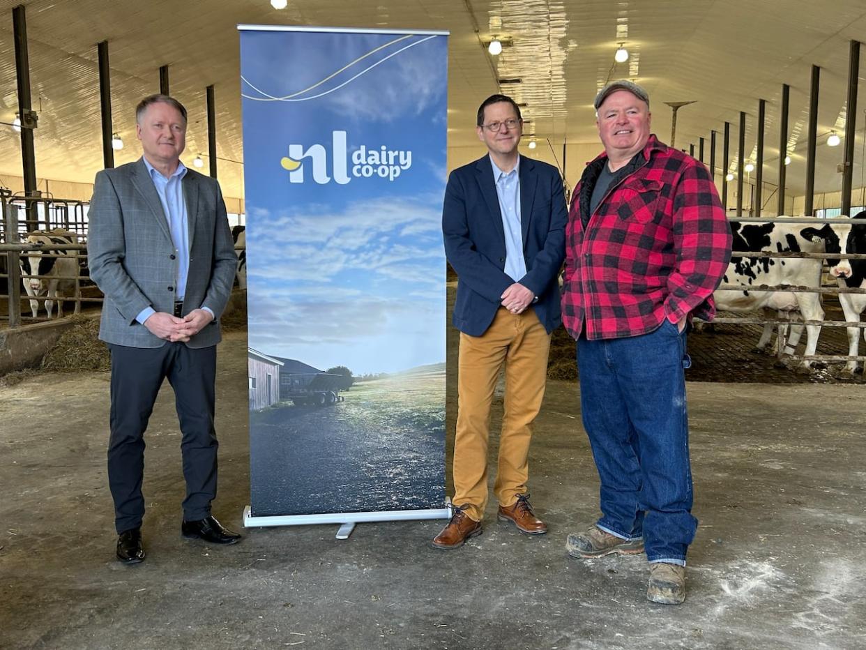 From left: Agriculture Minister Elvis Loveless, President Scott Antle and Dairy Farmer Crosbie Williams announced the official launch of the Newfoundland and Labrador Dairy Co-operative on Monday. The co-op is purchasing Central Dairies, which will ensure local milk production and processing. (Heather Gillis/CBC - image credit)