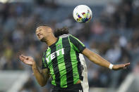 Austin FC defender Ruben Gabrielsen (4) and Los Angeles FC midfielder José Cifuentes, back, head the ball during the first half of an MLS soccer match in Los Angeles, Wednesday, May 18, 2022. (AP Photo/Ashley Landis)