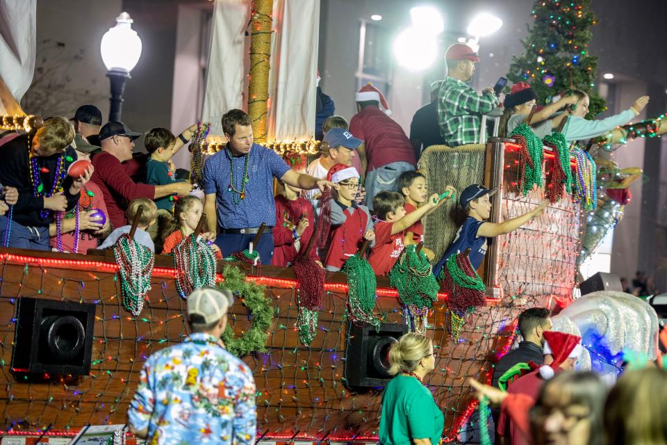 Floats make their way along Garden St. during the Pensacola Christmas Parade in Downtown Pensacola, Saturday, December 10, 2022.