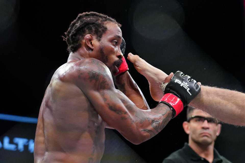 Bubba Jenkins blocks a kick from Bobby Moffett during a Professional Fighters League mixed martial arts bout in Atlantic City, N.J., Thursday, June 10, 2021. (AP Photo/Matt Rourke)