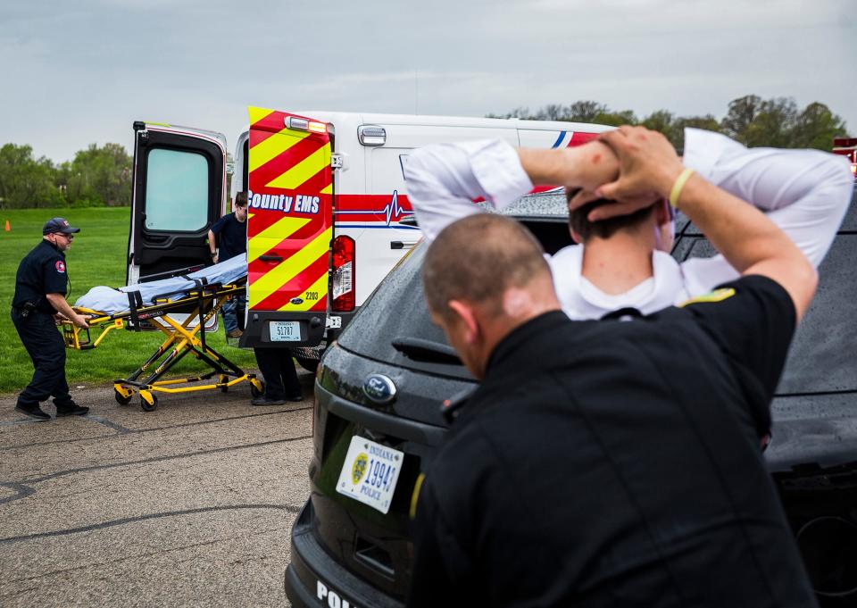 Volunteer, student actors worked with police and firefighters during the 2019 Living Proof Crash Re-Enactment at Central Wednesday. The event seeks to raise awareness of the dangers of driving while intoxicated with re-enactments of crashes, court scenes and funerals.