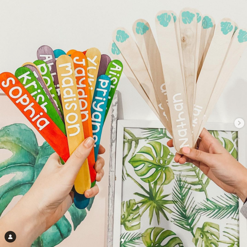 Oversized paddle pop sticks with name stickers such as Sophia, Madison, Nathan etc, made from a Cricut Joy,