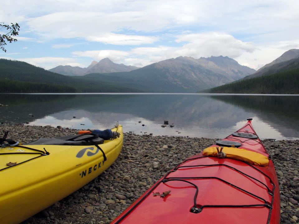 Kayaks sit on the shore of Kintla Lake in Glacier National Park, Mont., on Thursday, Sept. 5, 2013. Lyle Ruterbories, the National Park Service's oldest ranger at age 93, has managed the Kintla Lake campground since 1991. (AP Photo/Matt Volz)