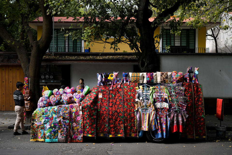 FILE - A car covered with handicrafts for sale is parked on a street in Mexico City, Dec. 4, 2023. Mexican President Andres Manuel Lopez Obrador swept into office in 2018 with the motto laying out his administration’s priorities: “For the good of all, first the poor.” (AP Photo/Eduardo Verdugo, File)