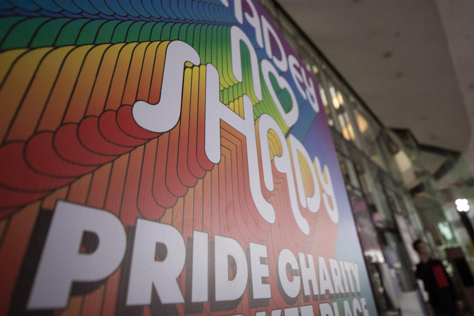 A poster for a same-sex charity event is displayed in Bangkok, Thursday, July 9 , 2020. Thailand's Cabinet has approved two draft bills that would give same-sex unions legal status similar to that of heterosexual marriages. (AP Photo/Sakchai Lalit)