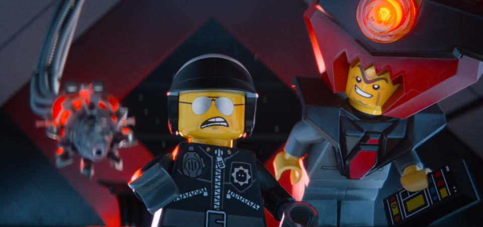 This image released by Warner Bros. Pictures shows the character Bad Cop/Good Cop, voiced by Liam Neeson, left, and President Business, voiced by Will Ferrell, in a scene from "The Lego Movie." (AP Photo/Warner Bros. Pictures)