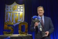 Feb 5, 2016; Santa Clara, CA, USA; NFL commissioner Roger Goodell holds the Vince Lombardi Trophy during a press conference at Moscone Center in advance of Super Bowl 50 between the Carolina Panthers and the Denver Broncos. Kirby Lee-USA TODAY Sports