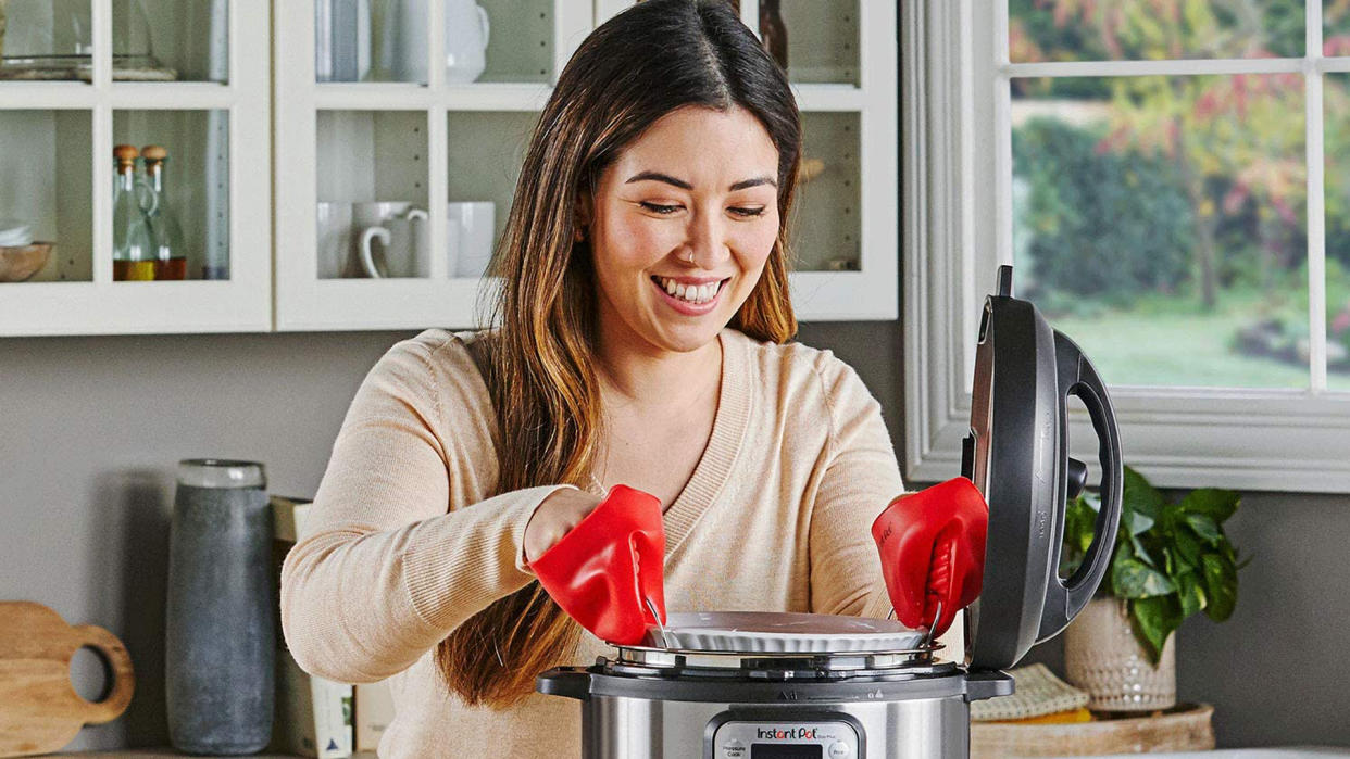  Instant Pot Prime Day Deals 2021: image of woman using Instant Pot. 