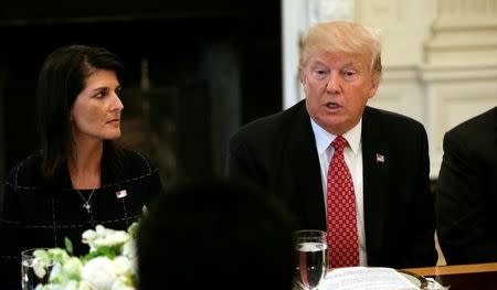 FILE PHOTO: With U.S. Ambassador to the United Nations Nikki Haley at his side (L), U.S. President Donald Trump speaks during a working lunch with ambassadors of countries on the UN Security Council at the White House in Washington, U.S., April 24, 2017. REUTERS/Kevin Lamarque/Files