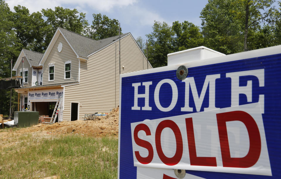 FILE - In this Monday, June 8, 2015 file photo, a sold sign is posted in front of a new home under construction in Mechanicsville, Va. Sales of new homes plunged sharply in September to the slowest pace in 10 months, according to Commerce Department report released Monday, Oct. 26, 2015, as higher prices and slower overall economic growth weigh on the housing market. (AP Photo/Steve Helber, File)