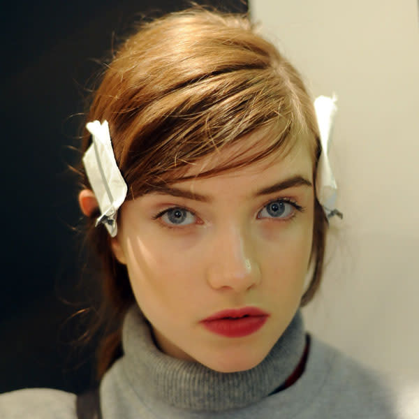 Hairstylists put tissue in the hair clips at Paul Smith to ensure the hair doesn't lose its shape © Getty