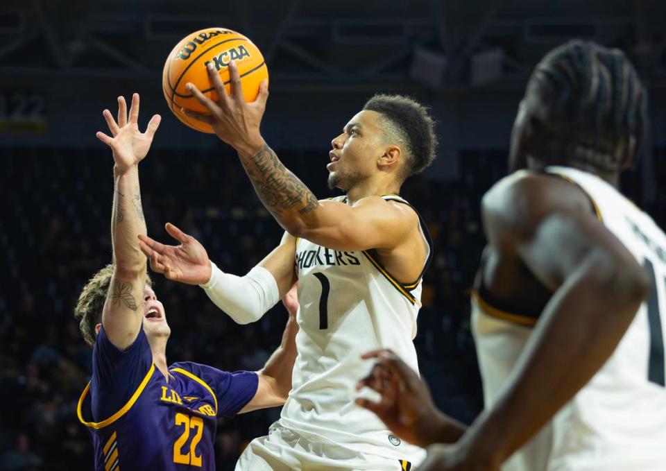 Wichita State’s Xavier Bell goes up for a shot against Lipscomb’s Joe Anderson during the first half of their season opener on Monday night at Koch Arena. Travis Heying/The Wichita Eagle