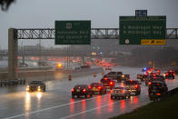 Cars turn around on southbound 288 because of a road blockage caused by Tropical Storm Beta flooding Tuesday, Sept. 22, 2020, in Houston. (Marie D. De Jesús/Houston Chronicle via AP)