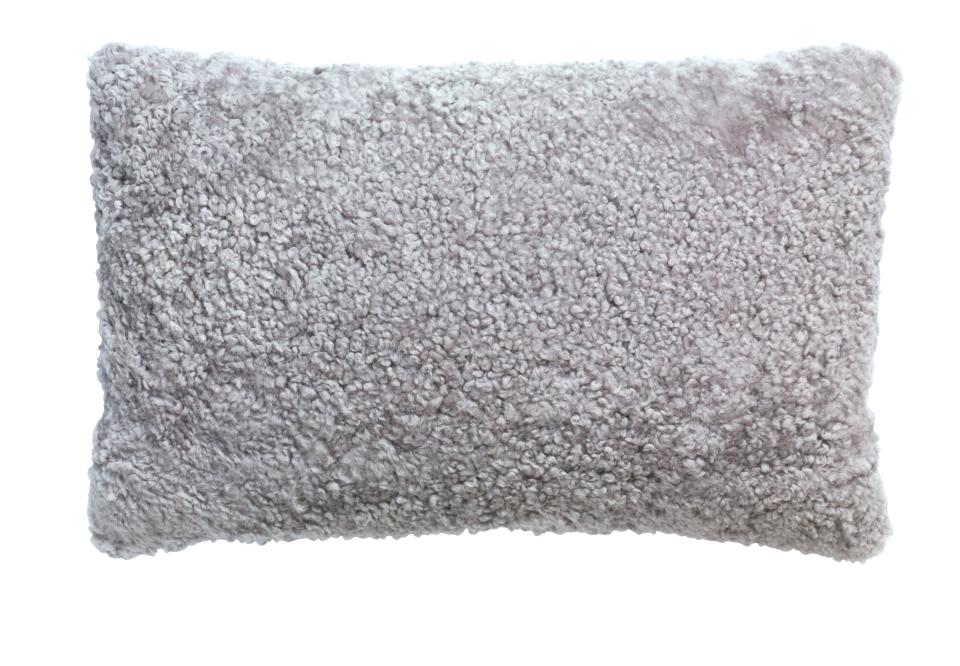 SHOP NOW: BJÖRKSNÄS 26"x16" sheepskin pillow cover in gray by IKEA, $35, ikea.com