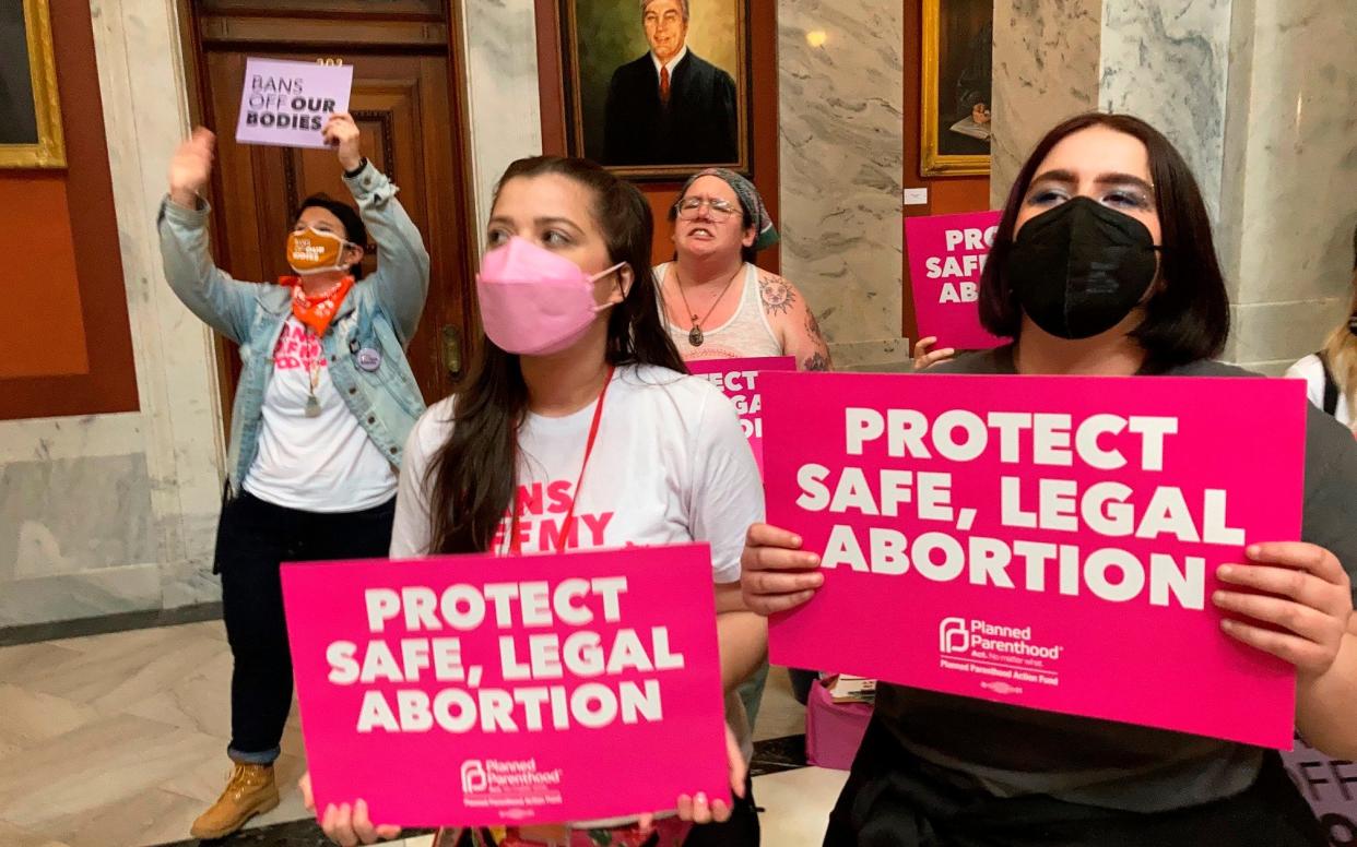 Abortion-rights supporters chant their objections at the Kentucky Capitol - AP