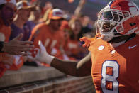 Clemson defensive tackle Tre Williams hypes up the crowd before an NCAA college football game against Notre Dame Saturday, Nov. 4, 2023, in Clemson, S.C. (AP Photo/Jacob Kupferman)