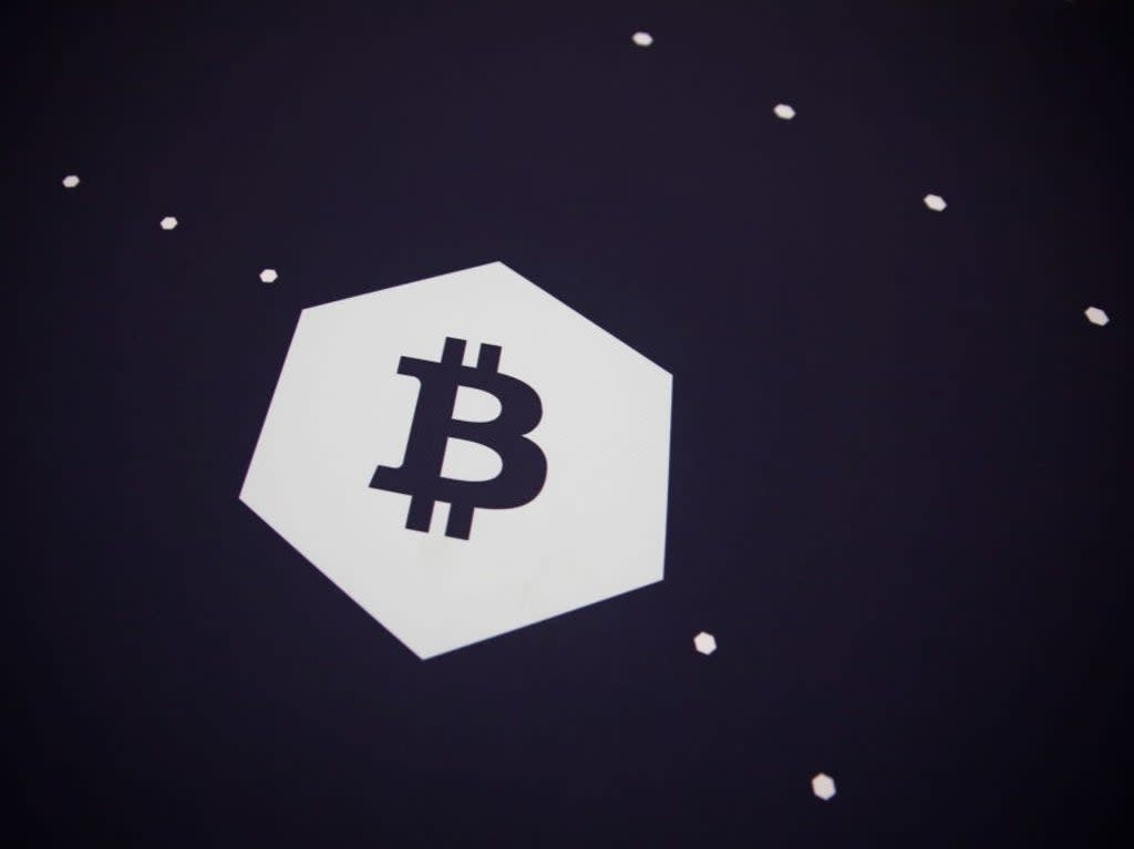 A bitcoin logo is seen during the Bitcoin 2022 Conference at Miami Beach Convention Center on 8 April, 2022 in Miami, Florida (Getty Images)