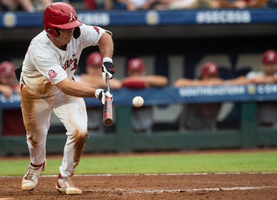 Arkansas Razorback's Chris Lanzilli (18) attempts a bunt during the SEC baseball tournament at Hoover Metropolitan Stadium in Hoover, Ala., on Wednesday, May 25, 2022. Alabama Crimson Tide defeated Arkansas Razorbacks 4-3.