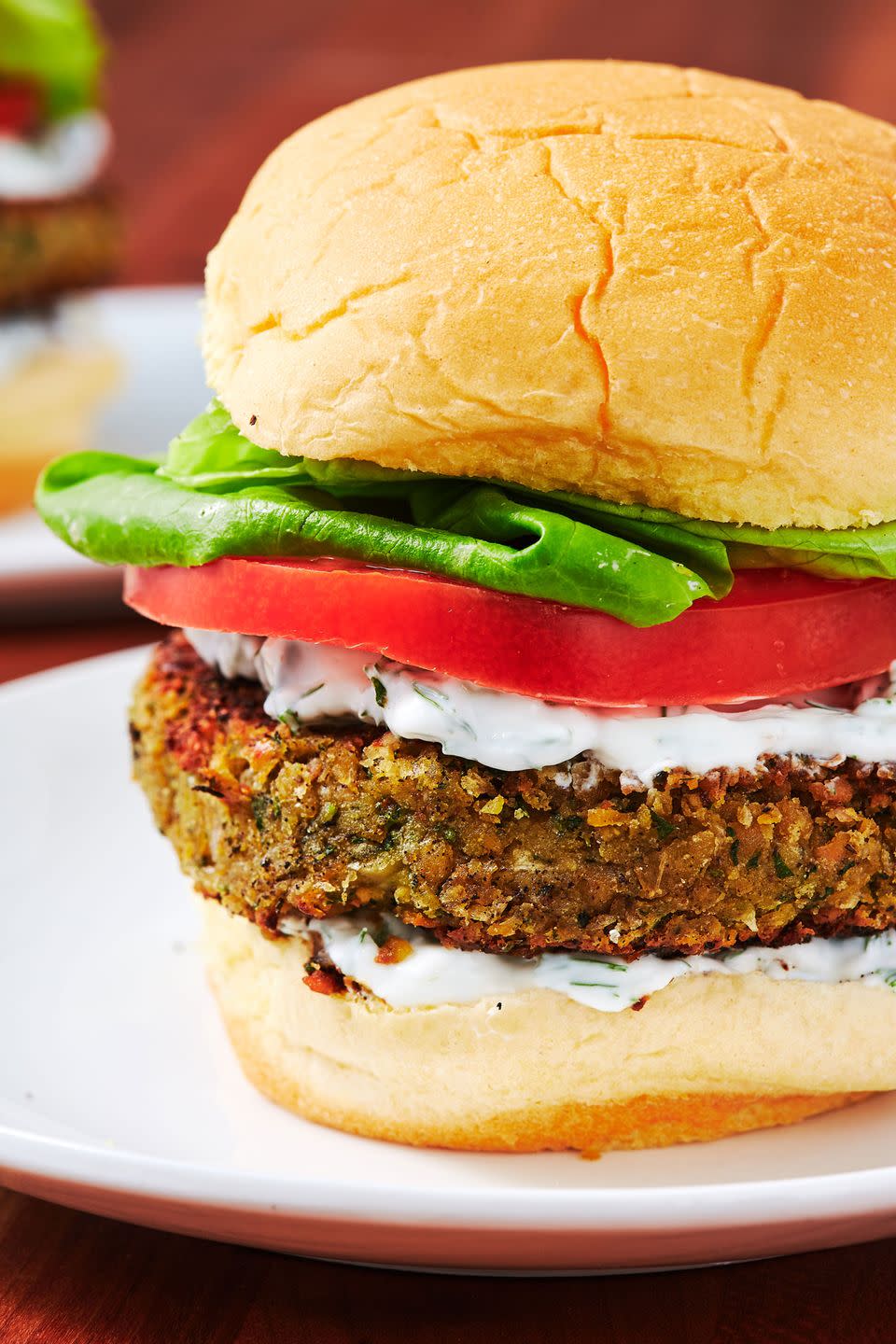 <p>Surprisingly, we found this vegetarian burger harder to perfect than our <a href="https://www.delish.com/cooking/recipe-ideas/recipes/a54231/easy-homemade-falafel-recipe/" rel="nofollow noopener" target="_blank" data-ylk="slk:classic fried falafel;elm:context_link;itc:0;sec:content-canvas" class="link ">classic fried falafel</a>. We figured out the solution after remembering that we had roasted the black beans in our <a href="https://www.delish.com/cooking/recipe-ideas/recipes/a5658/black-bean-burgers-recipe/" rel="nofollow noopener" target="_blank" data-ylk="slk:black bean burger;elm:context_link;itc:0;sec:content-canvas" class="link ">black bean burger</a>. Roasting the chickpeas to the point before they start to crisp draws out a ton of moisture. When you combine it with all the herbs, spices, and onion, the patties stay together easily!</p><p>Get the <strong><a href="https://www.delish.com/cooking/recipe-ideas/recipes/a47715/falafel-burgers-recipe/" rel="nofollow noopener" target="_blank" data-ylk="slk:Falafel Burgers recipe;elm:context_link;itc:0;sec:content-canvas" class="link ">Falafel Burgers recipe</a></strong>.</p>