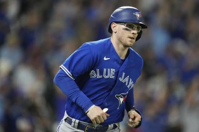 Toronto Blue Jays' Danny Jensen (9) hits a single during second inning AL  MLB baseball action against the Boston Red Sox, in Toronto on Saturday  October 1, 2022. THE CANADIAN PRESS/Christopher Katsarov