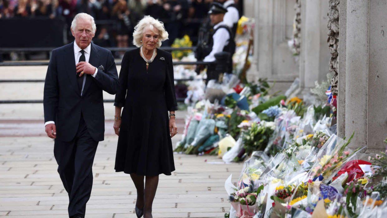 Britain's King Charles and Queen Camilla walk outside Buckingham Palace, following the passing of Britain's Queen Elizabeth, in London, Britain, September 9, 2022. REUTERS/Henry Nicholls