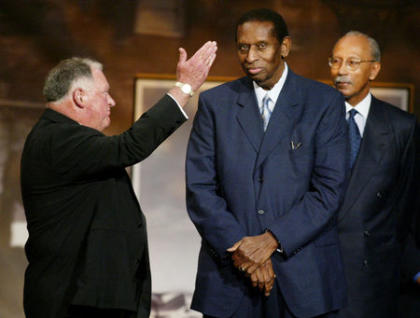 Earl Lloyd (center) was inducted into the Naismith Memorial Basketball Hall of Fame in 2003. (REUTERS/Jim Bourg)