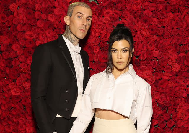 Cindy Ord/MG22/Getty Images for The Met Museum/Vogue Travis Barker and Kourtney Kardashian