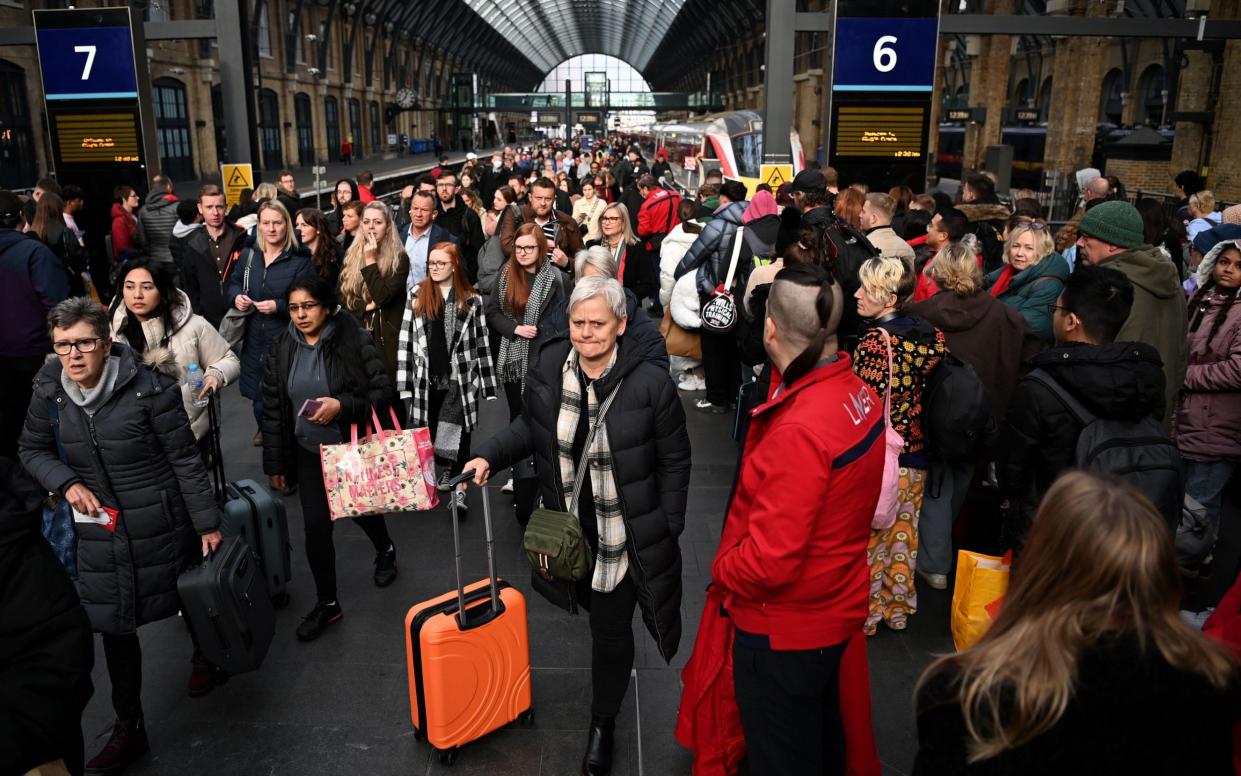 Commuters at Kings Cross in London - ANDY RAIN/EPA-EFE/Shutterstock