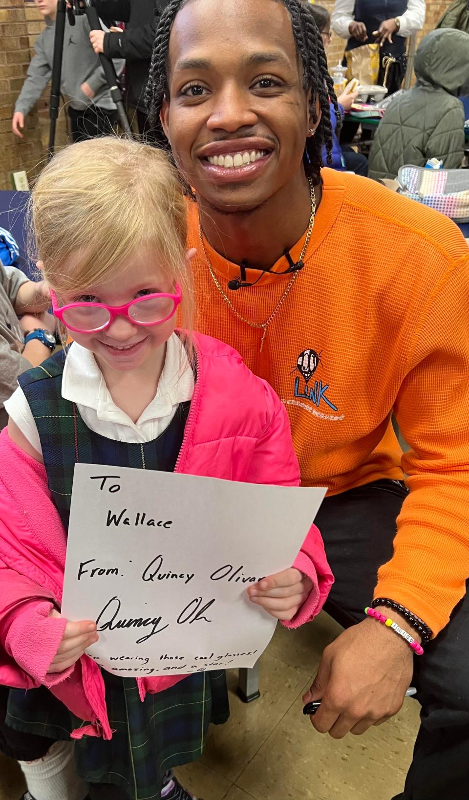 Xavier guard Quincy Olivari signed autographs and took pictures with several students at St. Mary School Hyde Park on Tuesday. He was the special guest of 6-year-old Xavier fan George Heller.