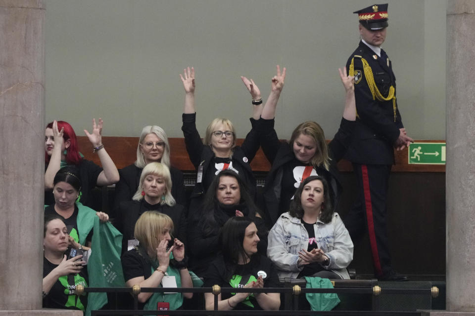 Abortion rights activists react after Poland's parliament voted to continue work on proposals to liberalize Poland's strict abortion law, in Warsaw, Poland, on Friday, April 12, 2024. Polish lawmakers voted Friday to continue work on proposals to lift a near total ban on abortion, a divisive issue in the traditionally Roman Catholic country, which has one of the most restrictive laws in Europe. (AP Photo/Czarek Sokolowski)