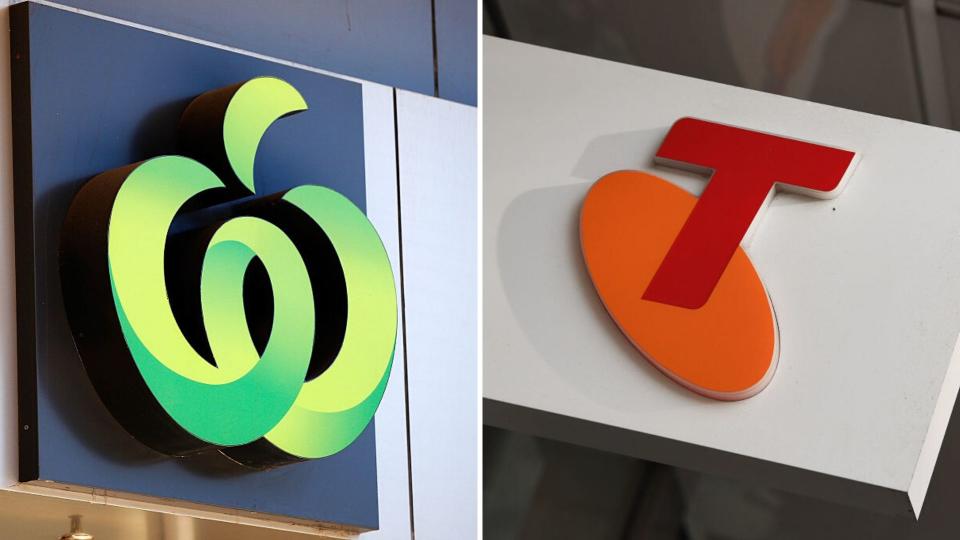 Pictured: Woolworths and Telstra logos. Images: Getty