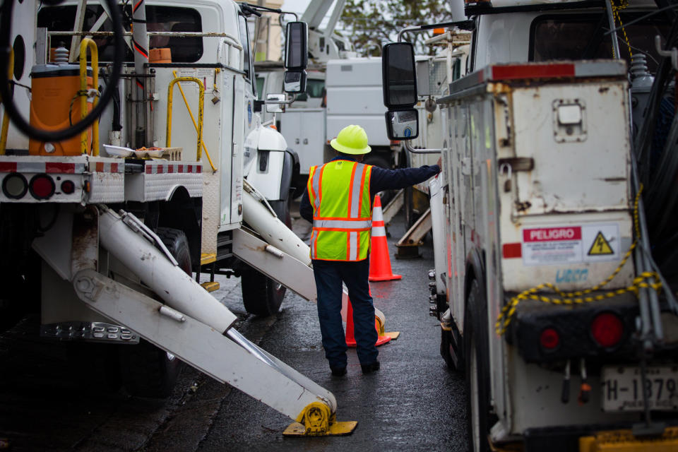 PREPA workers repair damage from Hurricane Maria in Canvanas, Puerto Rico, on Oct. 10. (Photo: Alex Flynn/Bloomberg via Getty Images)