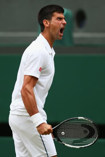 LONDON, ENGLAND - JULY 12:  Novak Djokovic of Serbia celebrates winning a point in the Final Of The Gentlemen&#39;s Singles against Roger Federer of Switzerland on day thirteen of the Wimbledon Lawn Tennis Championships at the All England Lawn Tennis and Croquet Club on July 12, 2015 in London, England.  (Photo by Clive Brunskill/Getty Images)