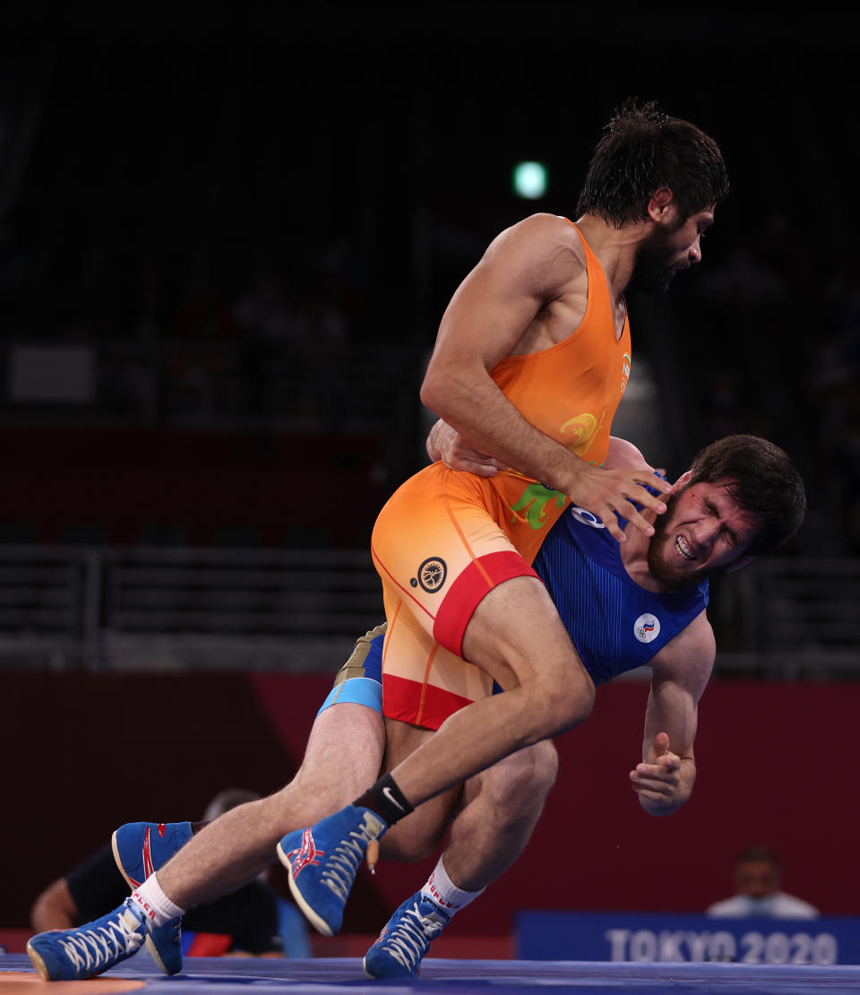 CHIBA, JAPAN - AUGUST 05: Zavur Uguev of Team ROC competes against Kumar Ravi of Team India during the Men's Freestyle 57kg Final on day thirteen of the Tokyo 2020 Olympic Games at Makuhari Messe Hall on August 05, 2021 in Chiba, Japan. (Photo by Maddie Meyer/Getty Images)